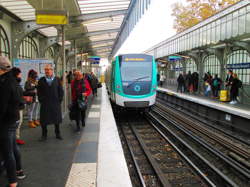 Paris Metro no. 2 train to Porte Dauphine arrive at Barbès–Rochechouart